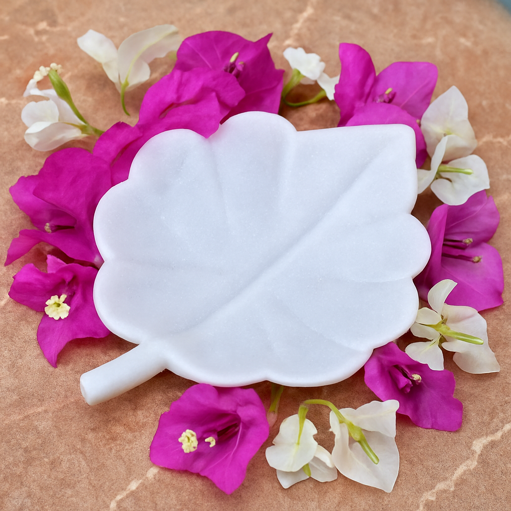 Hand-carved white marble leaf-shaped bowl used as a decorative dish for home or festive decor