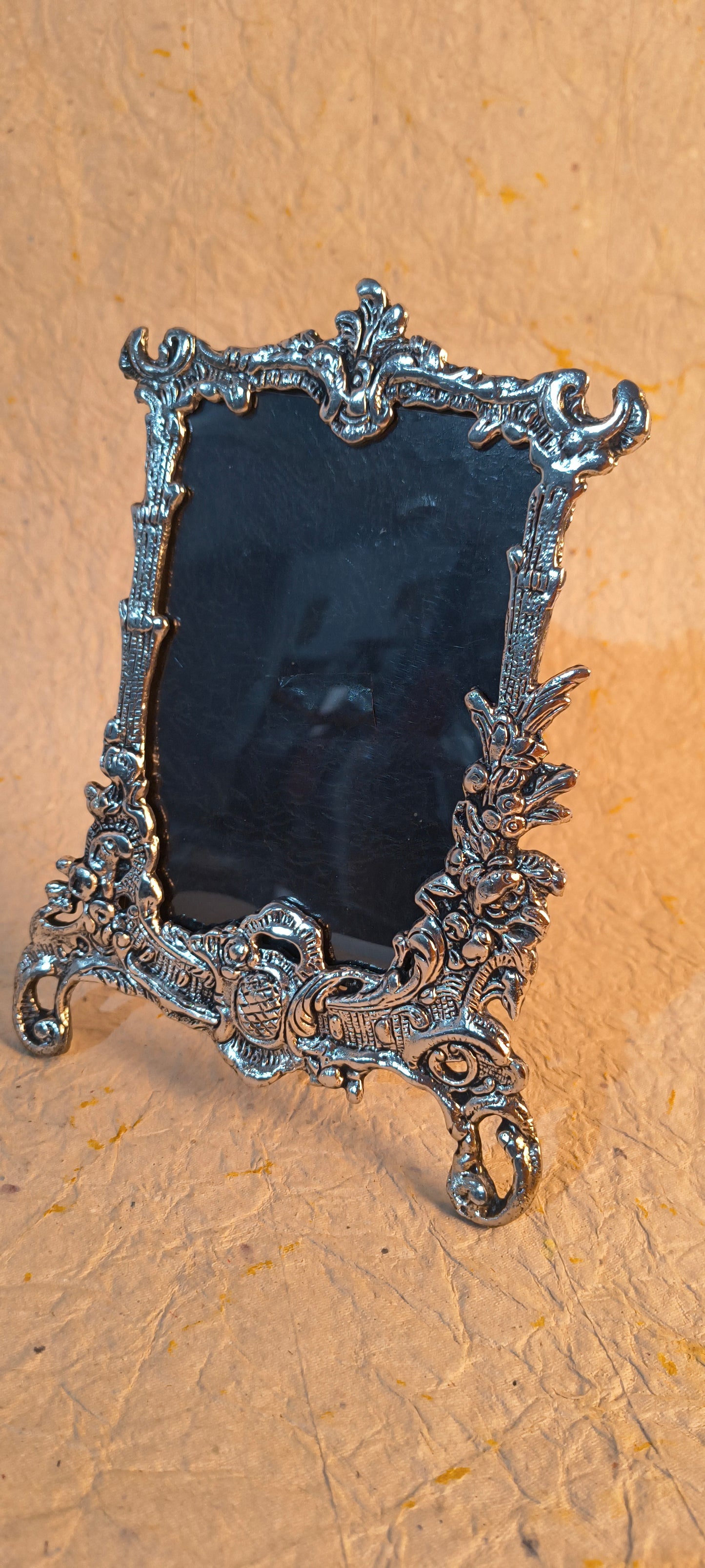 Decorative Silver Tone Photo Frame with Detailed Floral and Scrollwork Pattern
