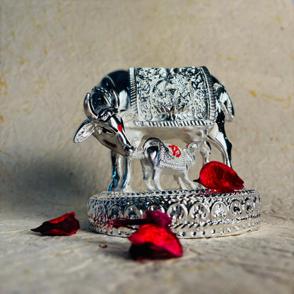 Silver Finish Kamdhenu Cow & Calf Decorative Idol with Ornamental Saddle Design for Home Temple, Desk Decor & Gifting.