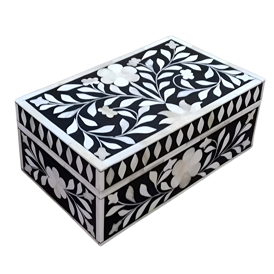 Artisan handcrafted bone inlay jewelry box open on a modern vanity table with elegant décor accents.