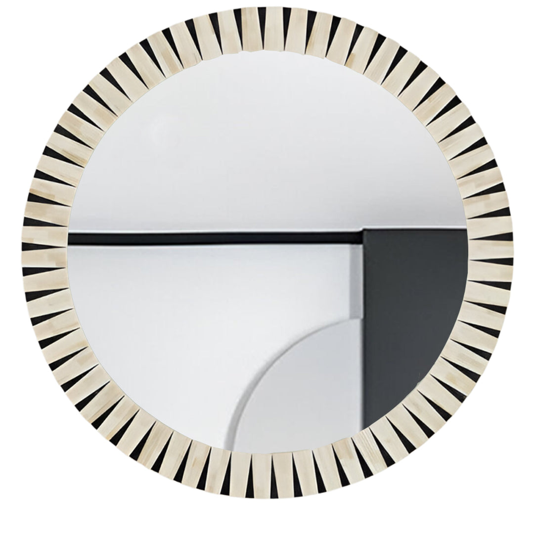 Handcrafted round bone inlay wall mirror above a contemporary console table.