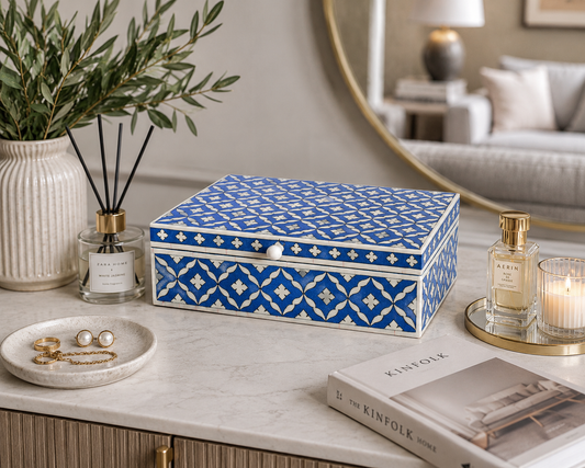 Handmade blue and white Moroccan bone inlay jewelry box on a modern marble vanity table