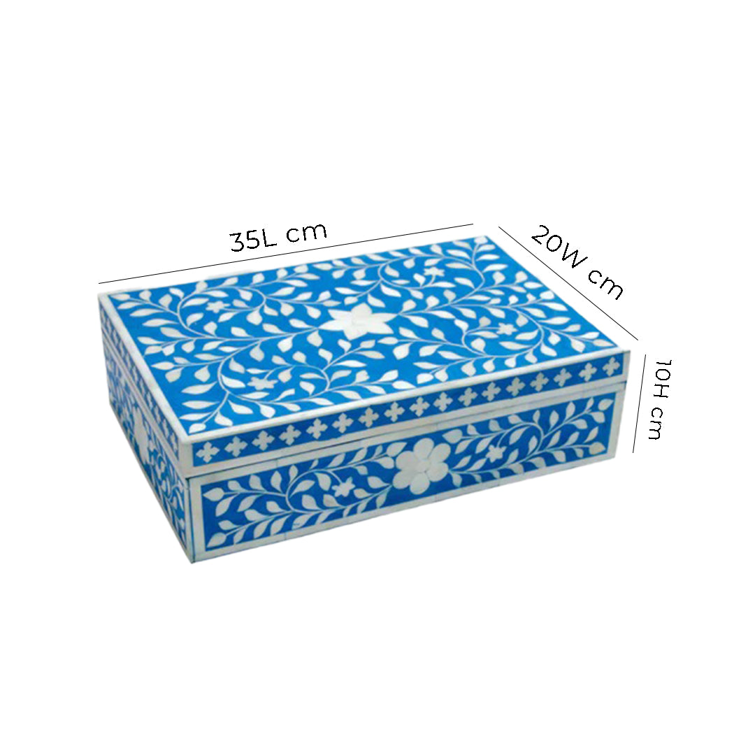 Luxury blue and white bone inlay keepsake box with floral design on a marble dresser