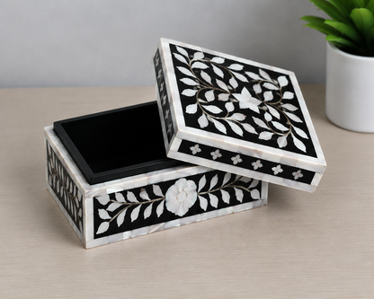 Luxury black mother of pearl inlay jewelry storage box with elegant botanical pattern.