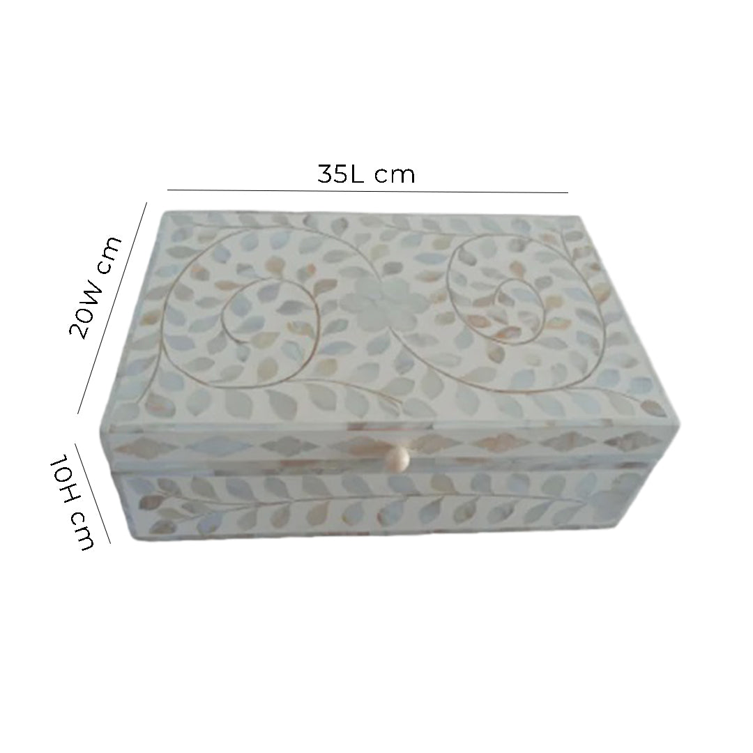 Handcrafted floral bone inlay keepsake box displayed on a modern console table