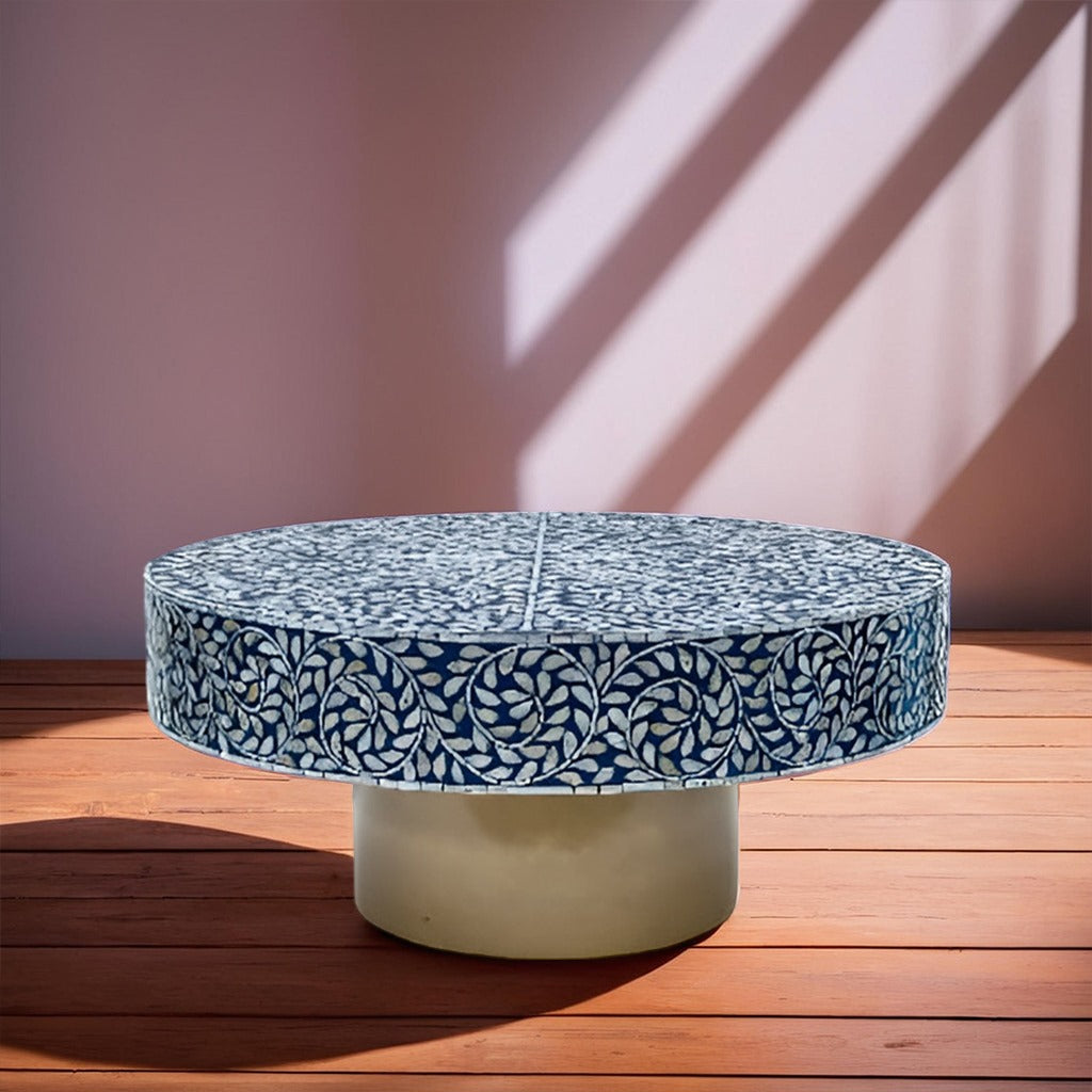 Handcrafted blue bone inlay coffee table with intricate floral pattern in contemporary home interior