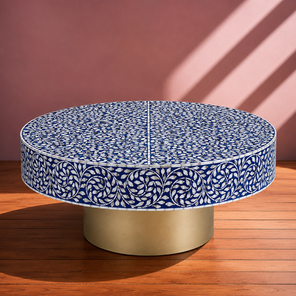 Blue floral bone inlay coffee table with pedestal base styled in elegant contemporary home decor