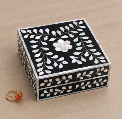 Artisan-crafted black Mother of Pearl jewelry box with floral motif for rings, earrings, and keepsakes.