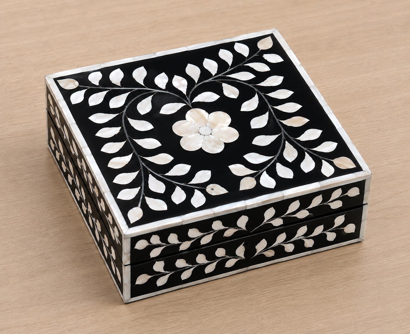 Artisan-crafted black Mother of Pearl jewelry box with floral motif for rings, earrings, and keepsakes.