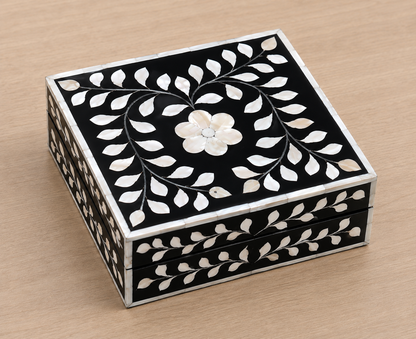 Artisan-crafted black Mother of Pearl jewelry box with floral motif for rings, earrings, and keepsakes.