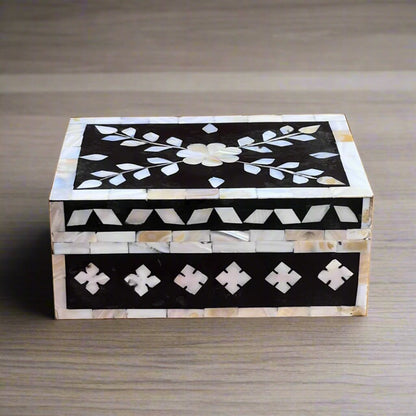 Elegant mother of pearl keepsake box with geometric border.