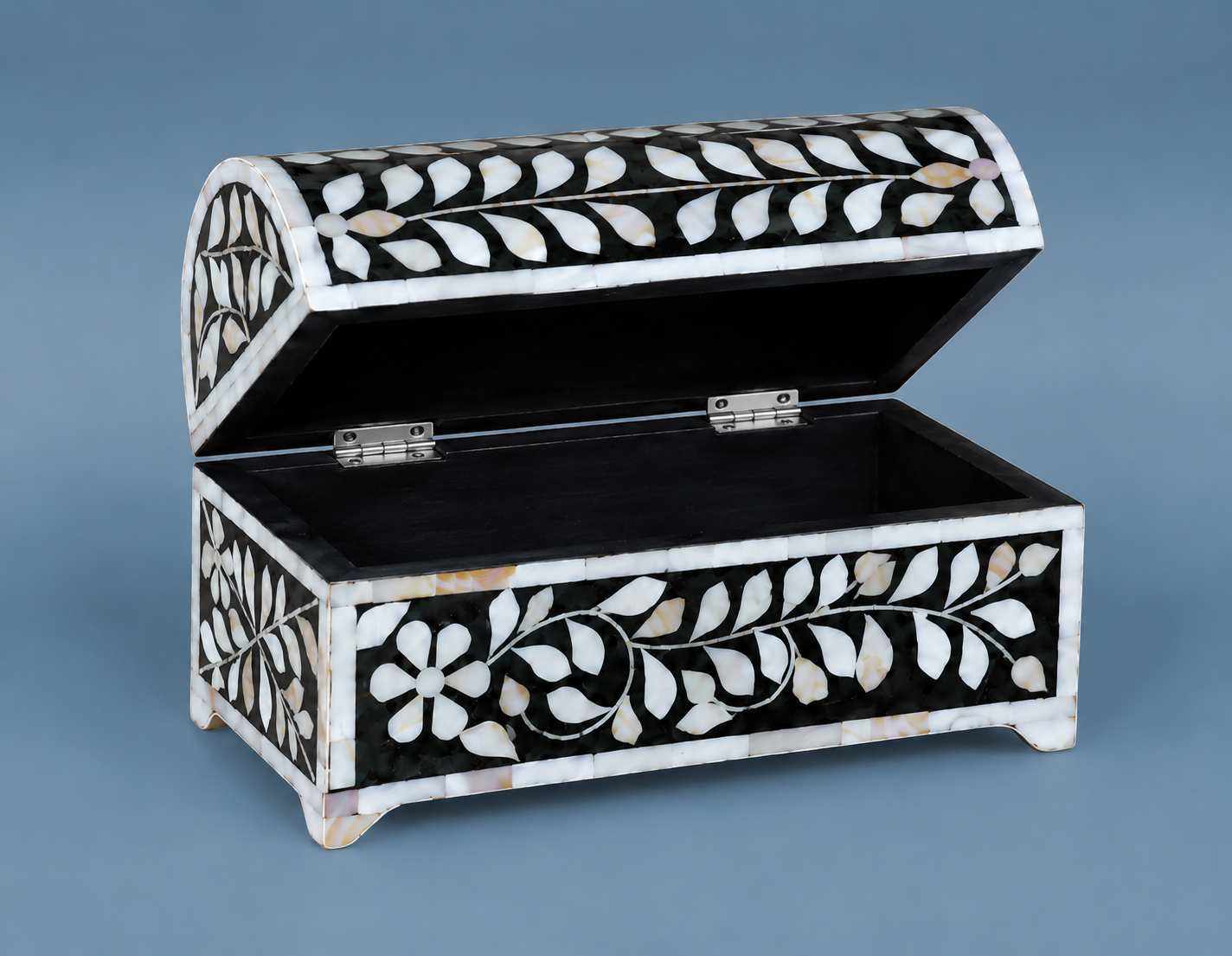Decorative Mother of Pearl keepsake box with jewelry on a modern dressing table