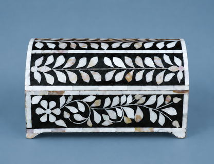 Personalized Mother of Pearl inlay jewelry box displayed on an elegant vanity setting