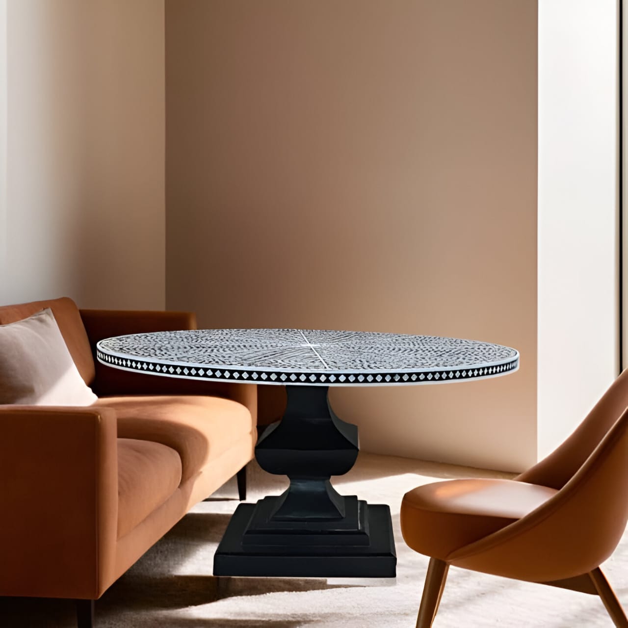 Handmade round bone inlay dining table with black pedestal base and contemporary luxury interior styling.