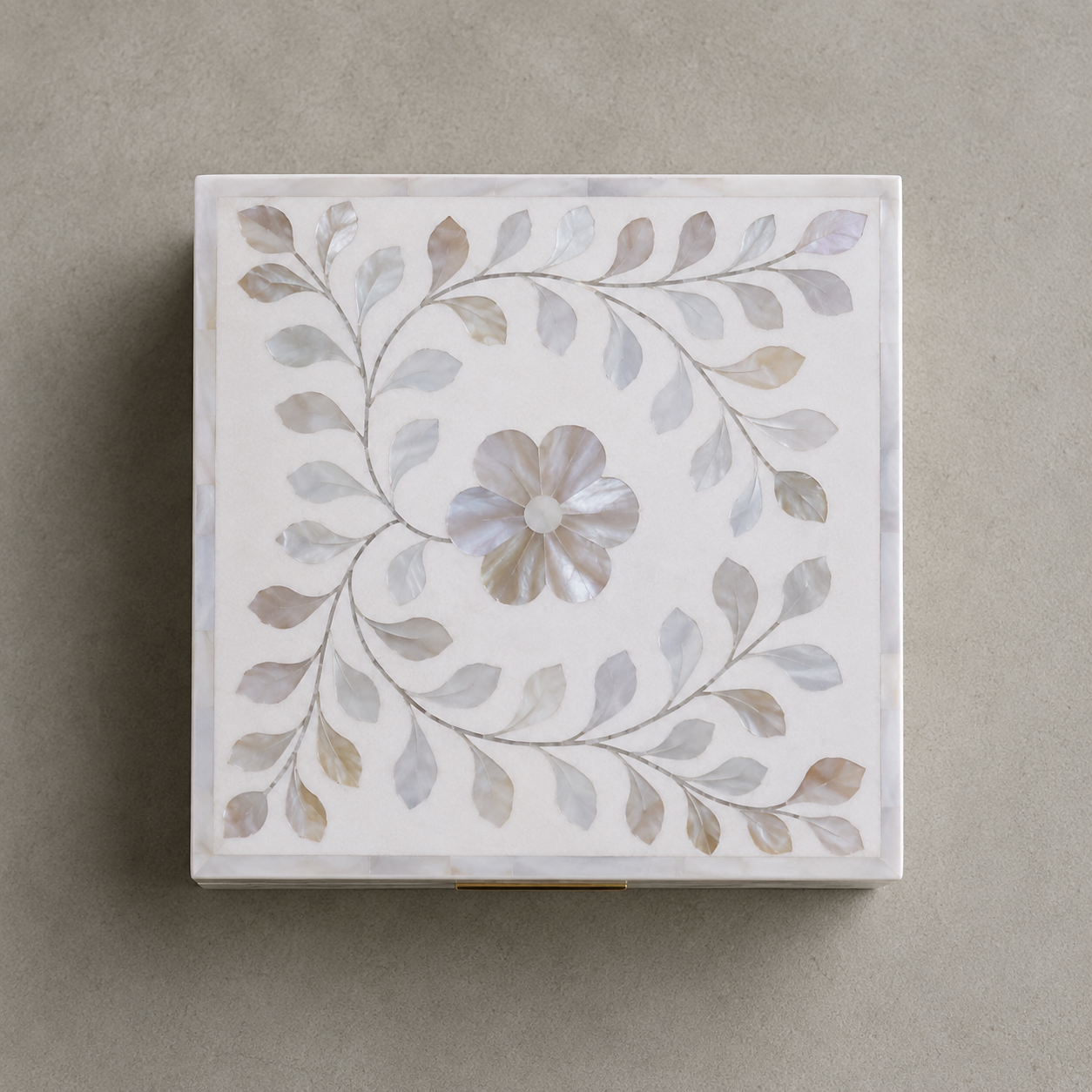 Elegant white mother of pearl jewelry box with floral vine design and removable top lid.