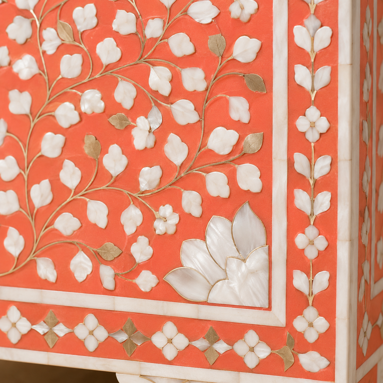 Close-Up of Floral Vine Bone Inlay Craftsmanship on Peach Cabinet