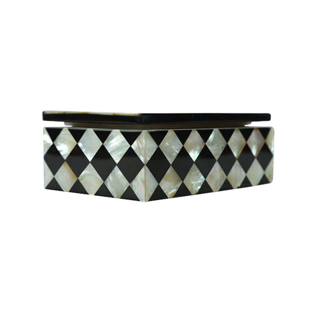 Luxury Mother of Pearl jewelry box featuring a black and white geometric inlay design with gold and pearl accessories.