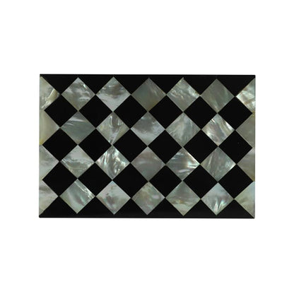 Artisan-crafted Mother of Pearl jewelry storage box with black geometric design on a soft beige fabric backdrop.