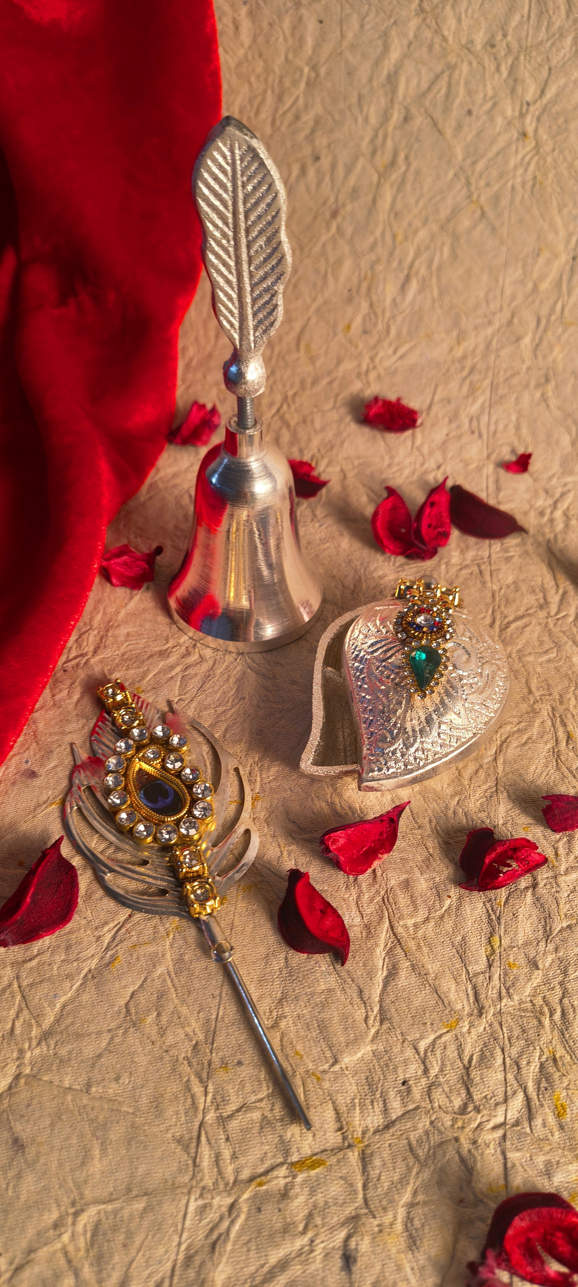 Traditional Hindu Worship Bell and Decorative Kumkum Box with Peacock Feather Accessory