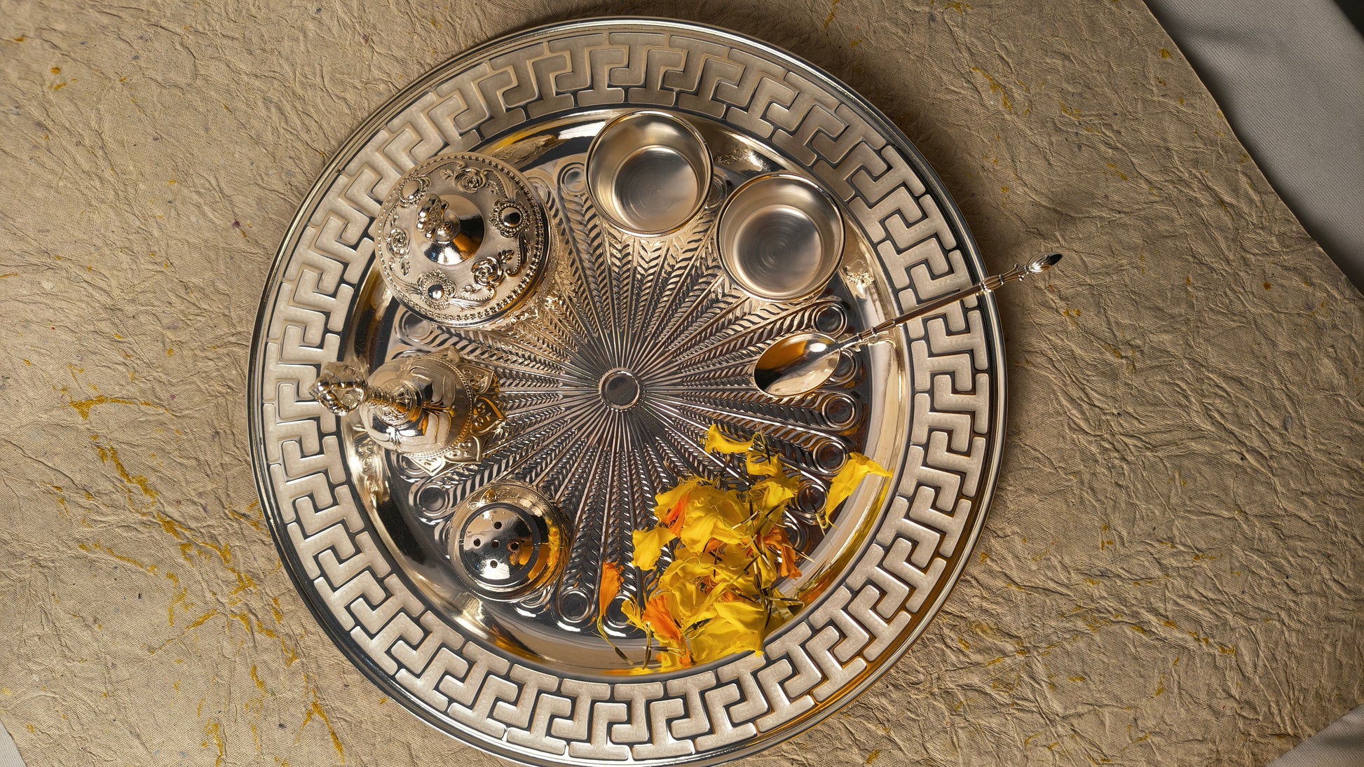 Elegant Round Pooja Plate Set with Bell, Containers and Spoon for Daily Worship.