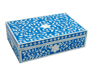 Decorative floral bone inlay jewelry box styled with candles, flowers, and perfume bottles