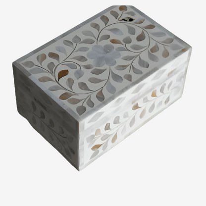 Elegant white bone inlay storage box with floral design on a marble tabletop